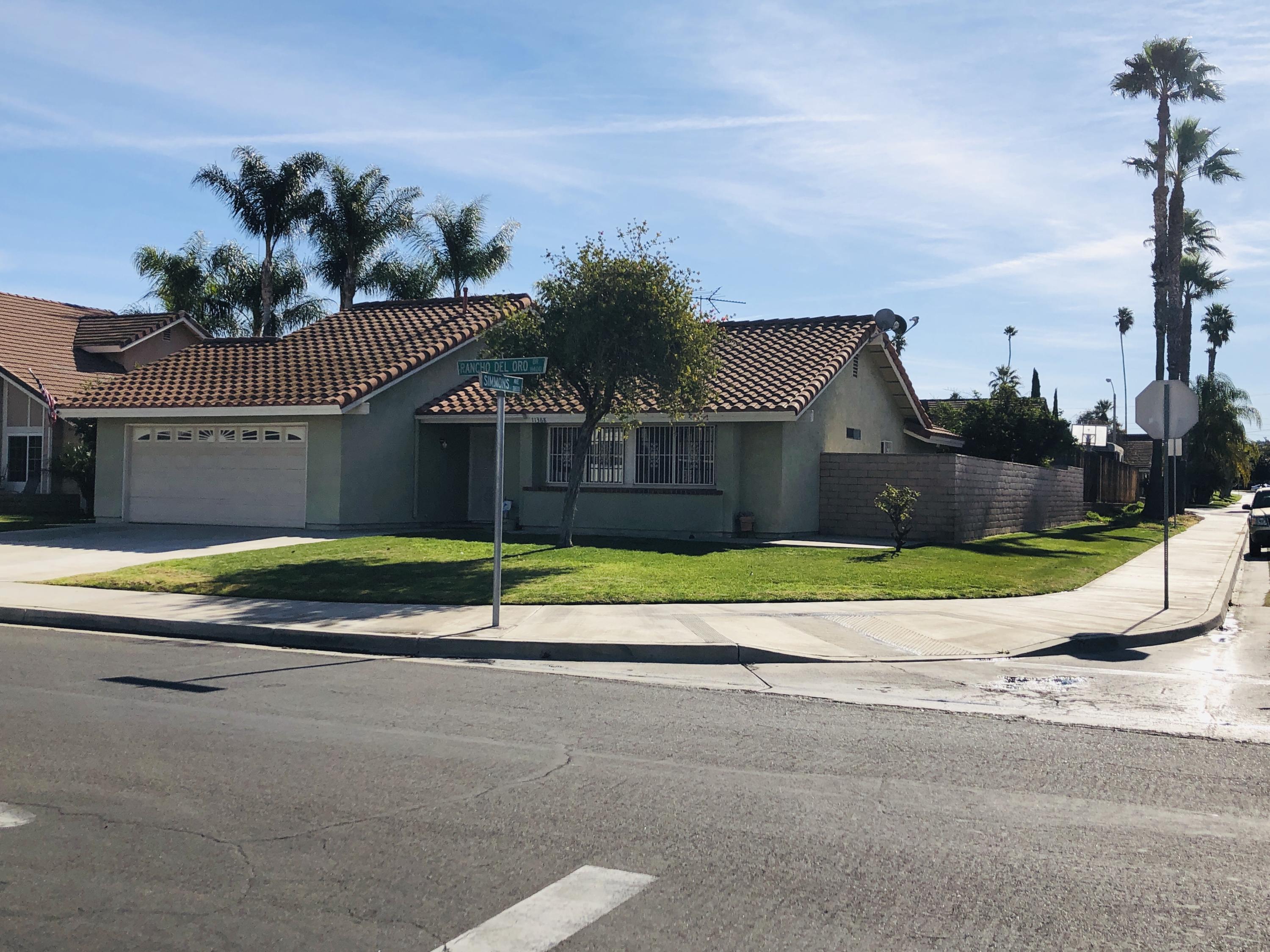 11368 Rancho Del Oro Drive Riverside, CA 92505 - Photo 2 of 20 a view of a house with a swimming pool and a yard