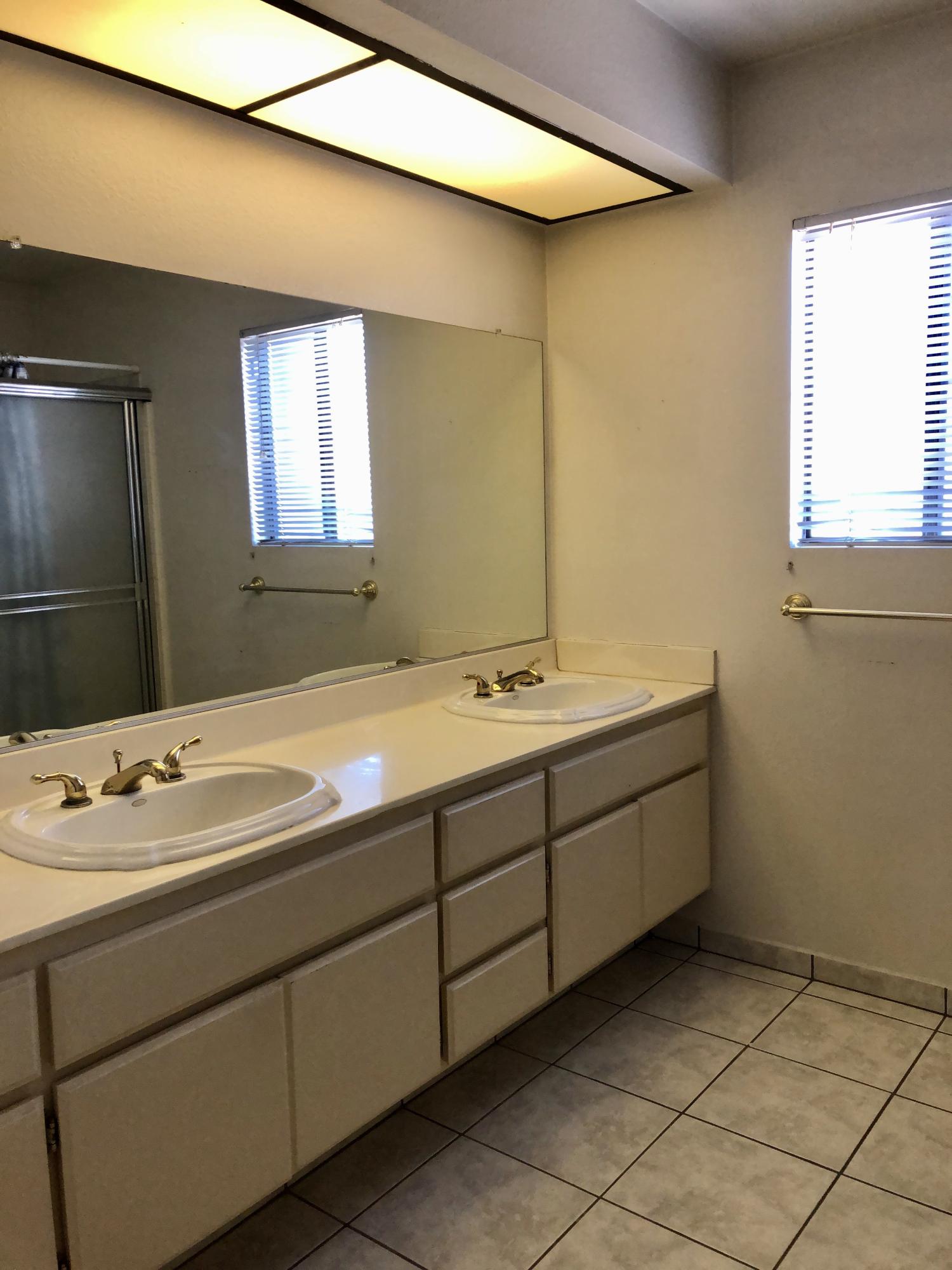 11368 Rancho Del Oro Drive Riverside, CA 92505 - Photo 11 of 20 a bathroom with a sink and a mirror