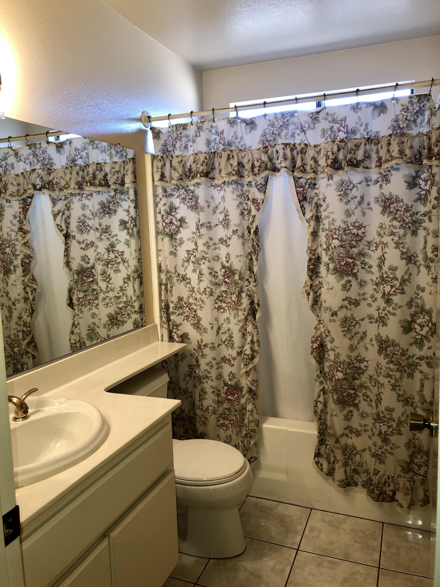 11368 Rancho Del Oro Drive Riverside, CA 92505 - Photo 14 of 20 a bathroom with a toilet and shower