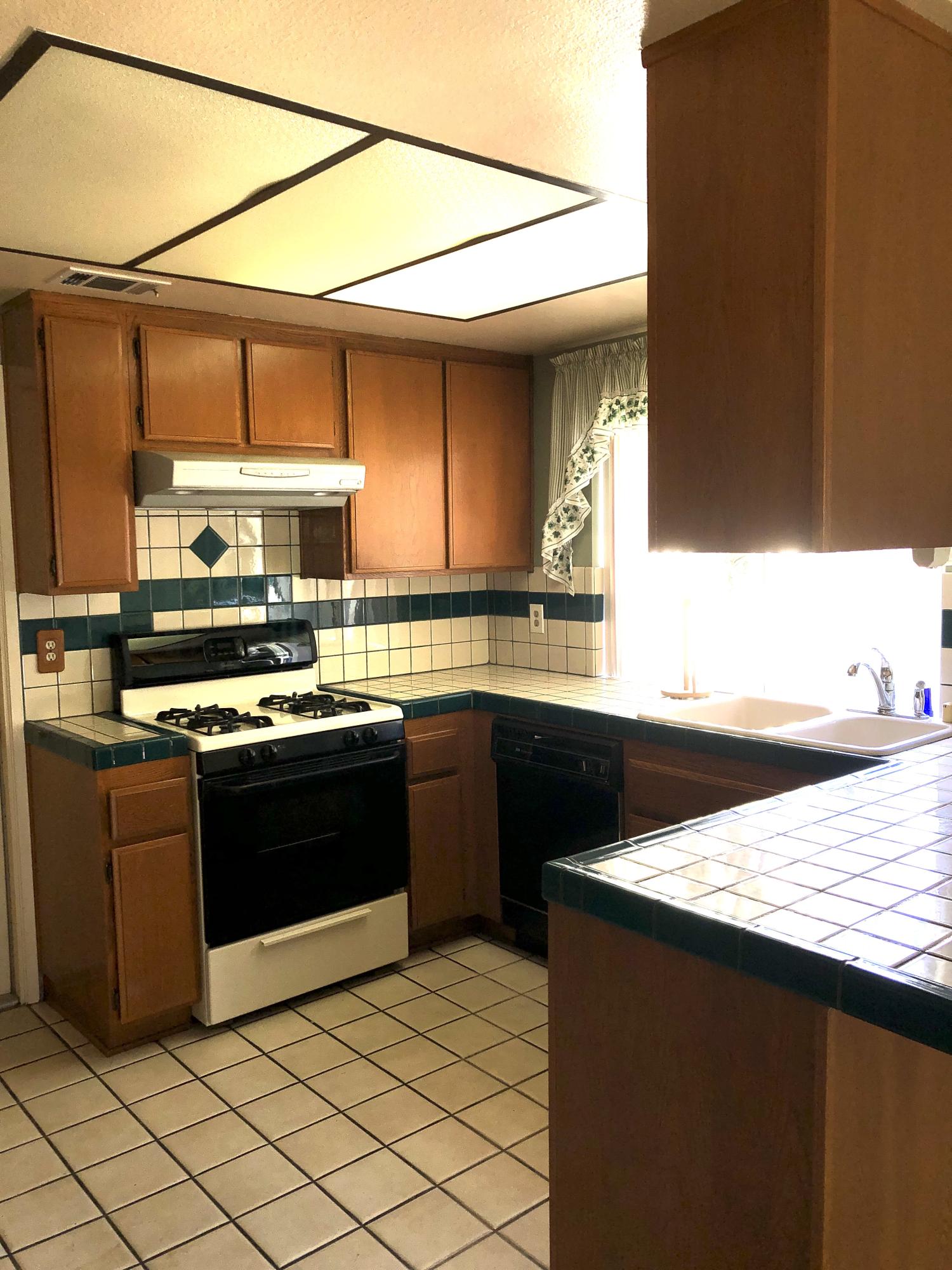 11368 Rancho Del Oro Drive Riverside, CA 92505 - Photo 5 of 20 a kitchen with stainless steel appliances granite countertop a sink and a stove