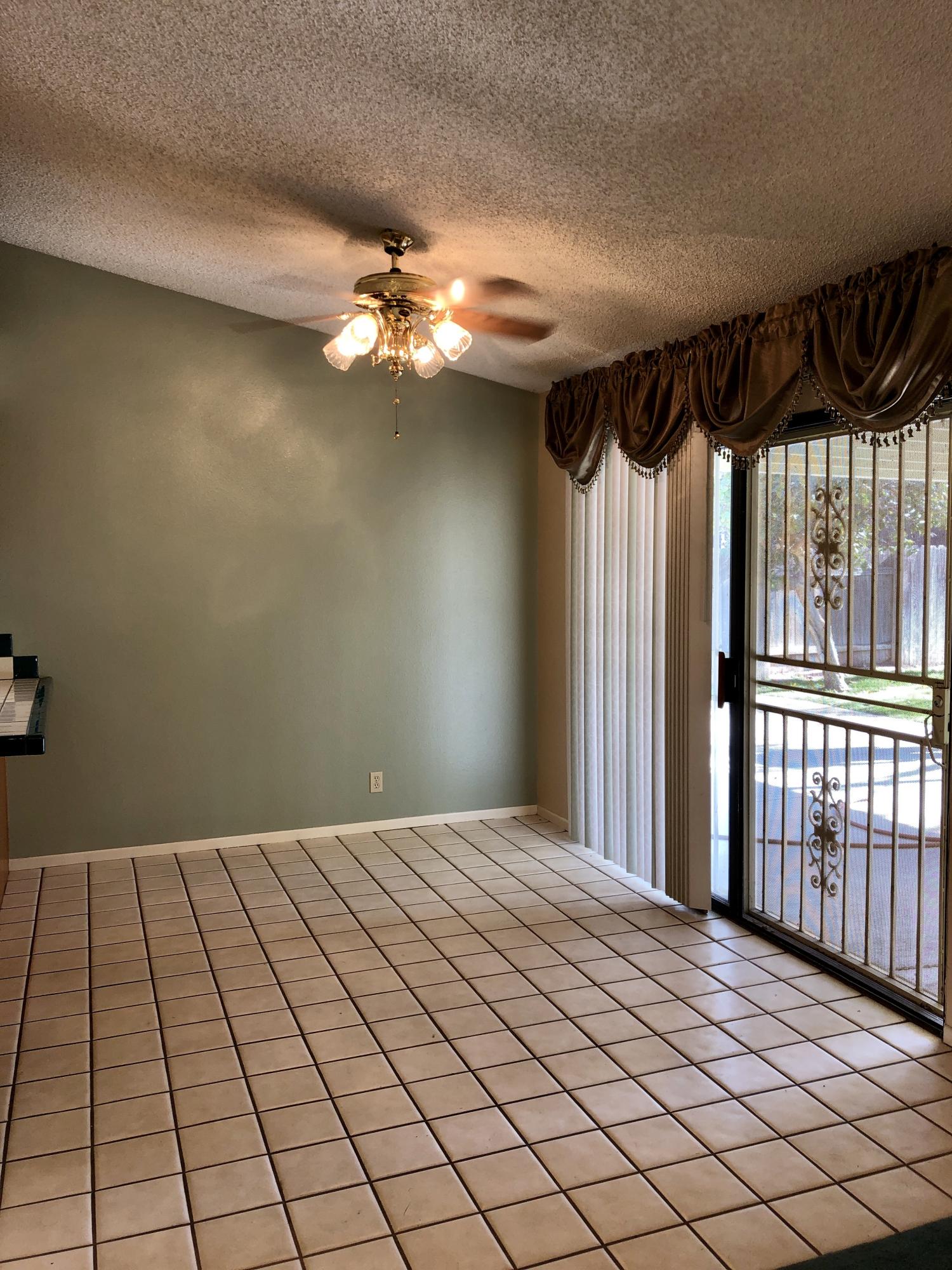 11368 Rancho Del Oro Drive Riverside, CA 92505 - Photo 7 of 20 a view of a livingroom with a chandelier fan and window