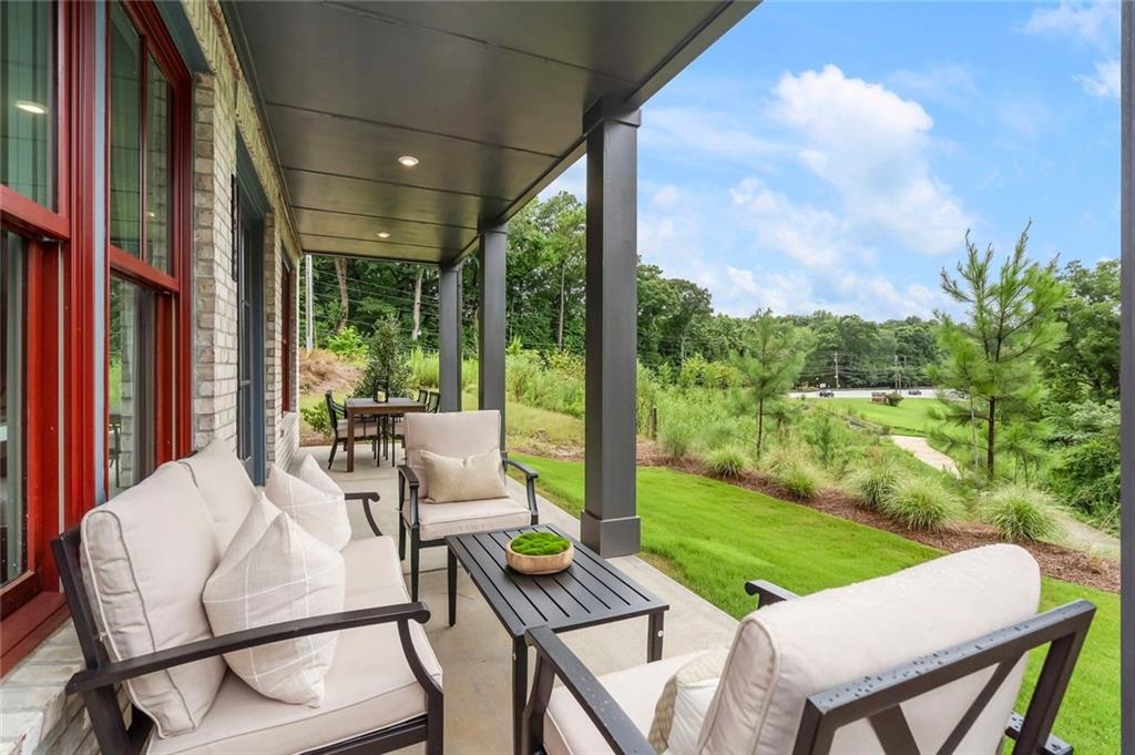 3932 Calm Court Chamblee, GA 30341 - Photo 14 of 27 a view of a patio with a table chairs and a backyard