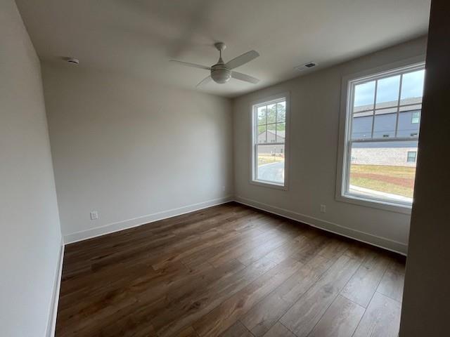 3932 Calm Court Chamblee, GA 30341 - Photo 24 of 27 an empty room with wooden floor and windows