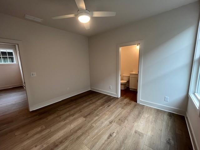 3932 Calm Court Chamblee, GA 30341 - Photo 26 of 27 an empty room with wooden floor and windows