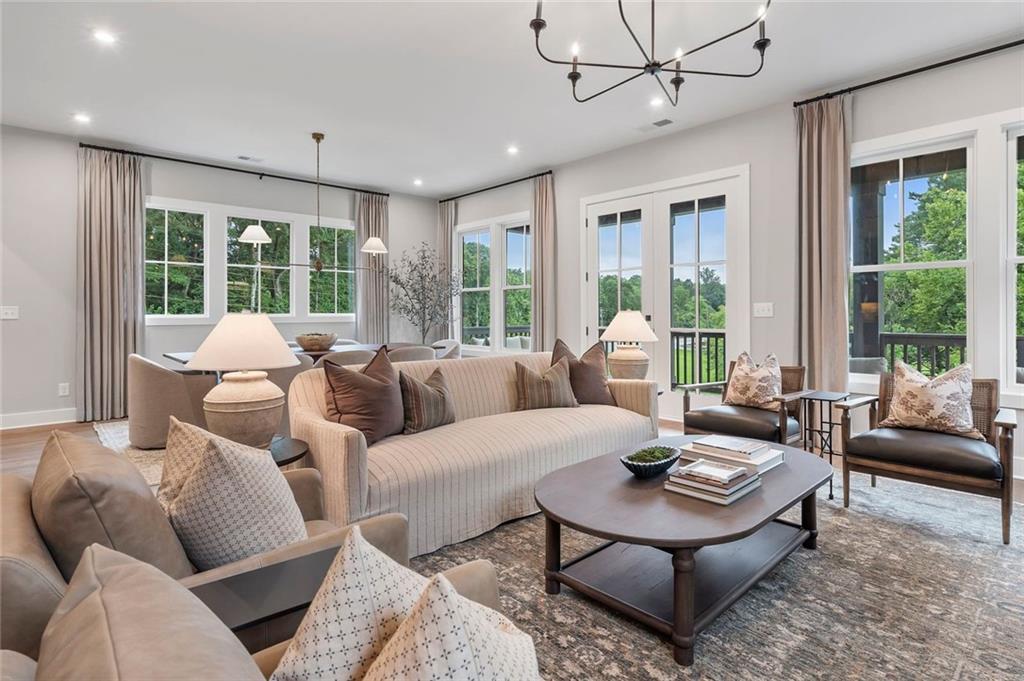 3932 Calm Court Chamblee, GA 30341 - Photo 6 of 27 a living room with furniture and large windows