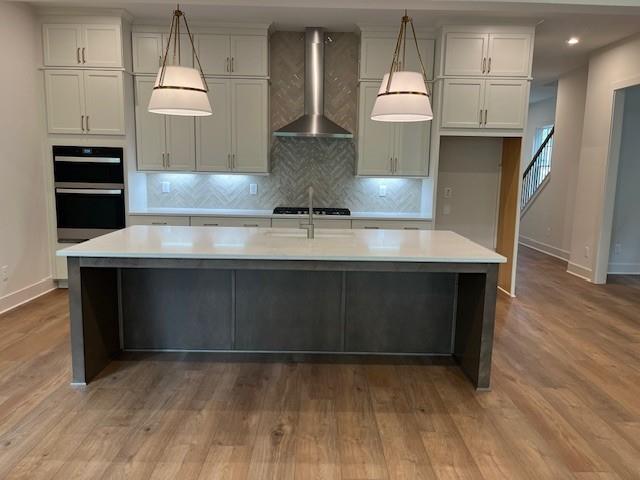 3932 Calm Court Chamblee, GA 30341 - Photo 10 of 27 a kitchen with kitchen island a counter space a sink and appliances