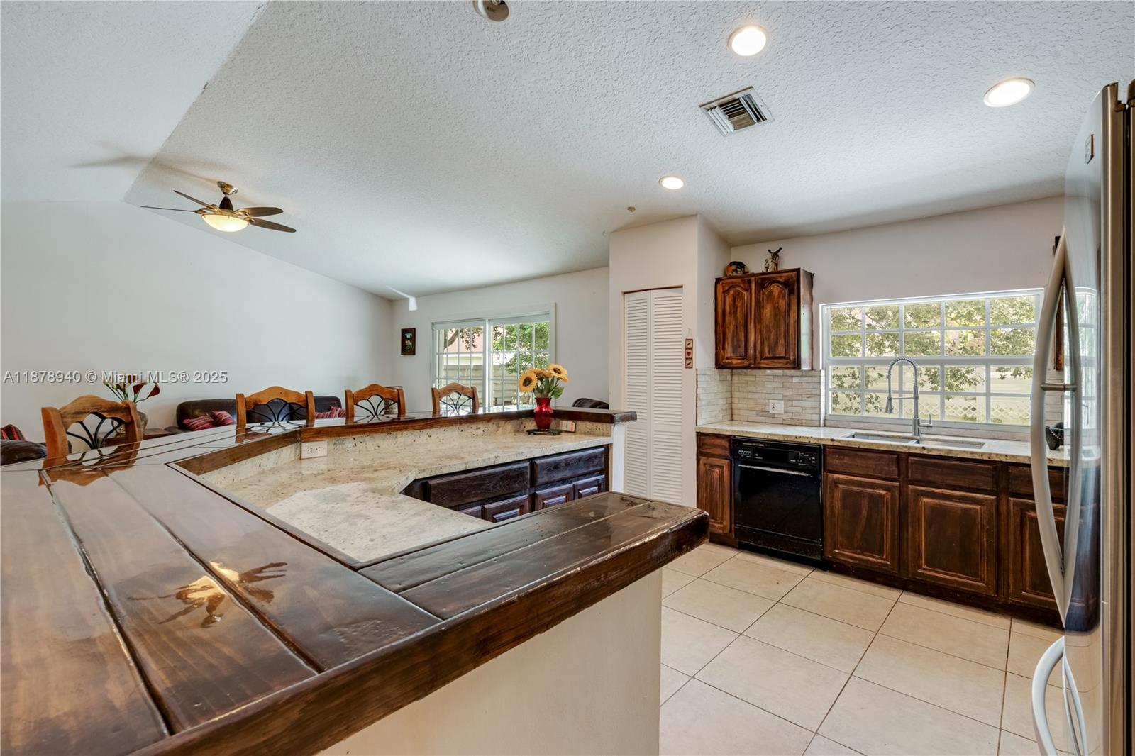 15025 Southwest 141st Court Miami, FL 33186 - Photo 12 of 29 a kitchen with a stove and a sink