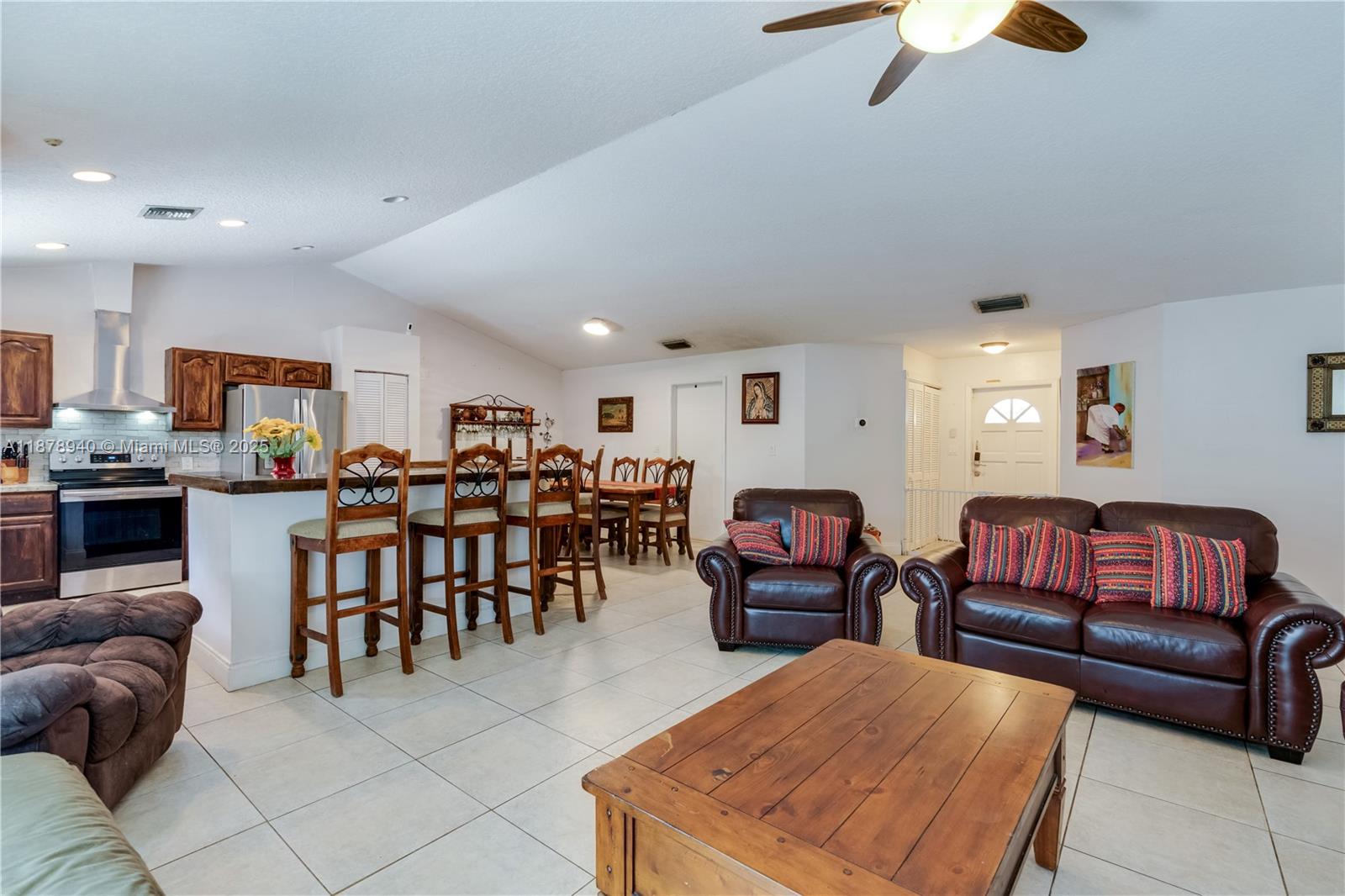 15025 Southwest 141st Court Miami, FL 33186 - Photo 15 of 29 a living room with furniture kitchen view and a dining table