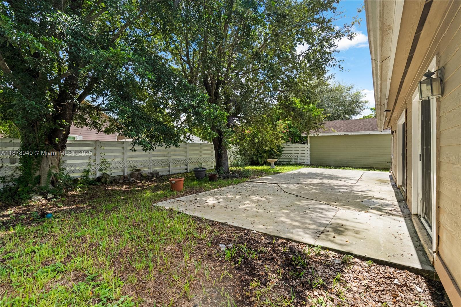 15025 Southwest 141st Court Miami, FL 33186 - Photo 21 of 29 a view of backyard of house with green space