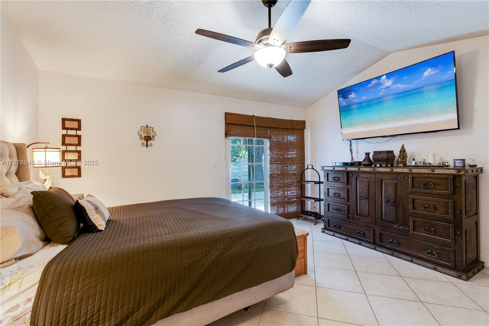 15025 Southwest 141st Court Miami, FL 33186 - Photo 23 of 29 a bedroom with a bed and a flat screen tv