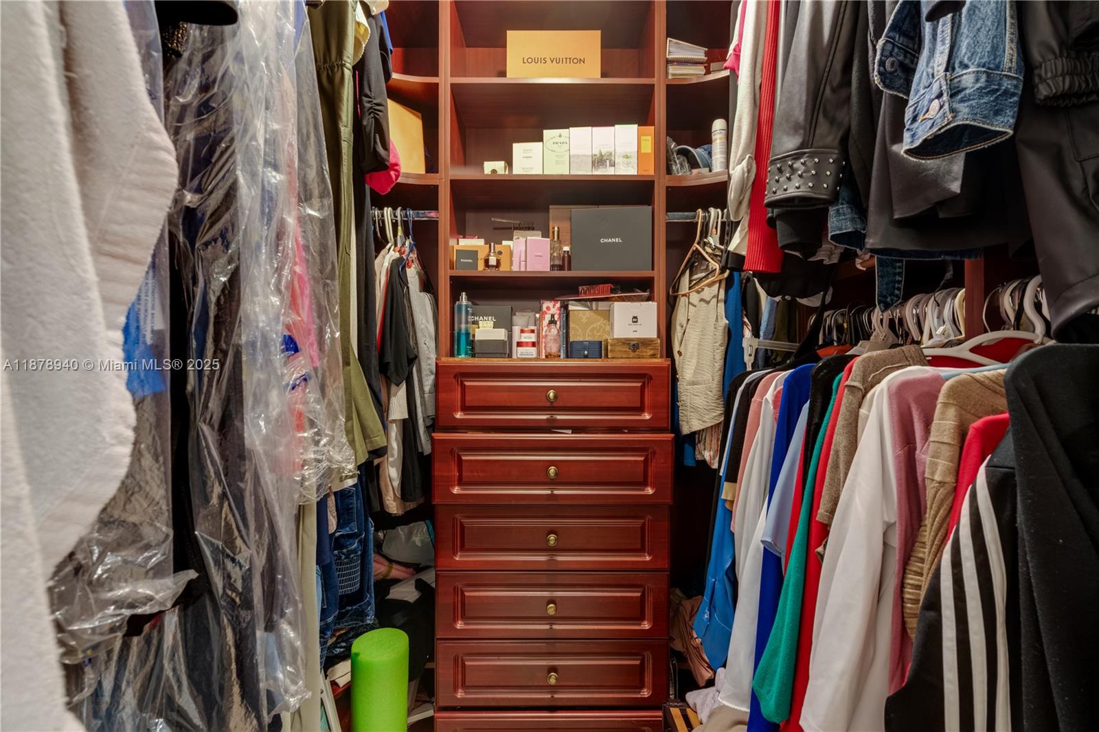 15025 Southwest 141st Court Miami, FL 33186 - Photo 25 of 29 a view of walk in closet with clothes and shoes