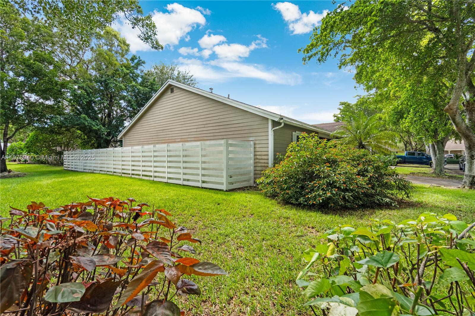 15025 Southwest 141st Court Miami, FL 33186 - Photo 4 of 29 a view of a backyard with a garden