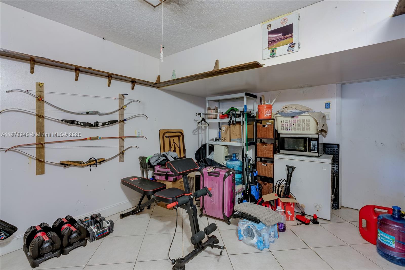 15025 Southwest 141st Court Miami, FL 33186 - Photo 5 of 29 a storage room with musical instruments