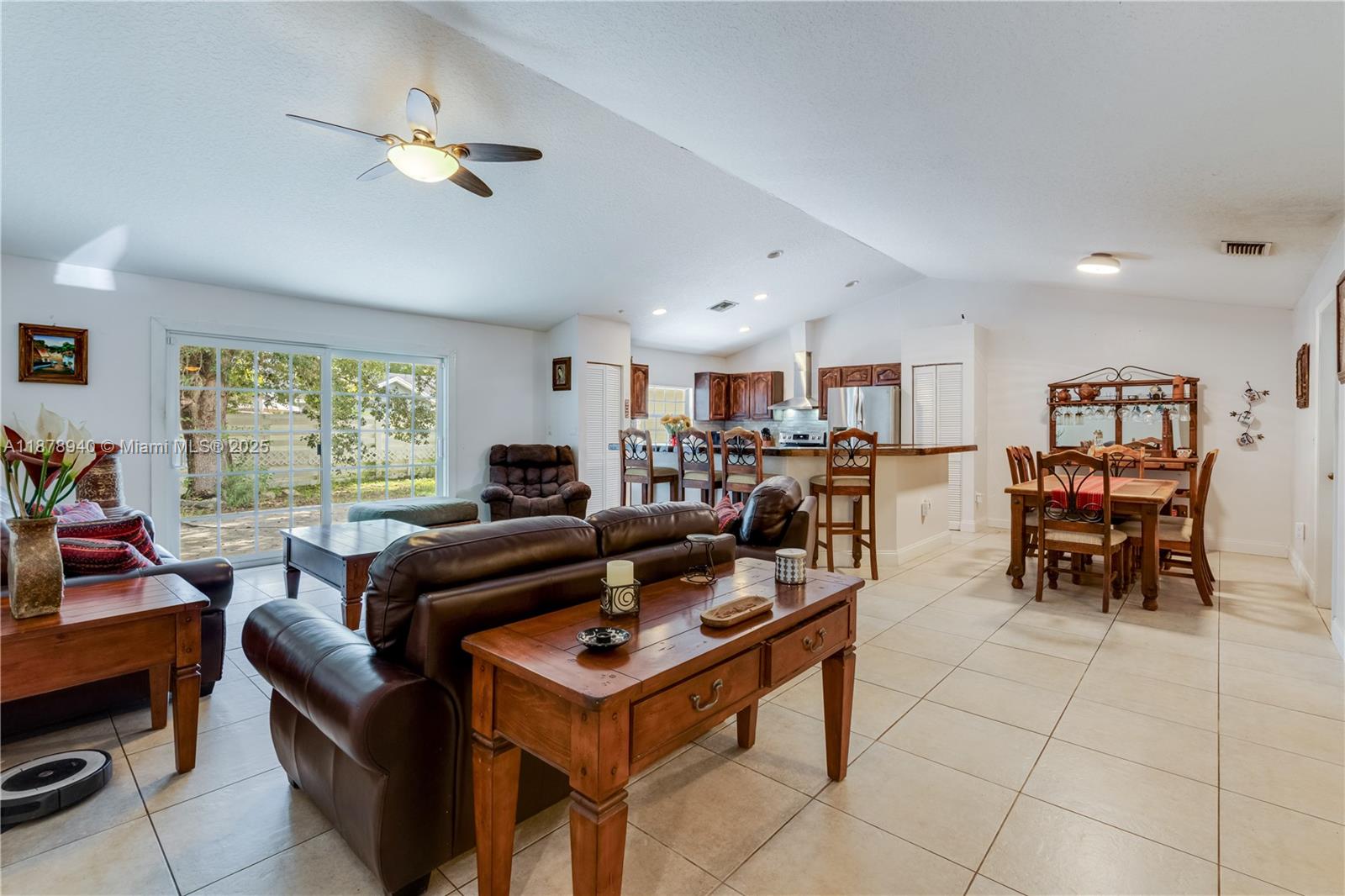15025 Southwest 141st Court Miami, FL 33186 - Photo 7 of 29 a living room with lots of furniture and a large window