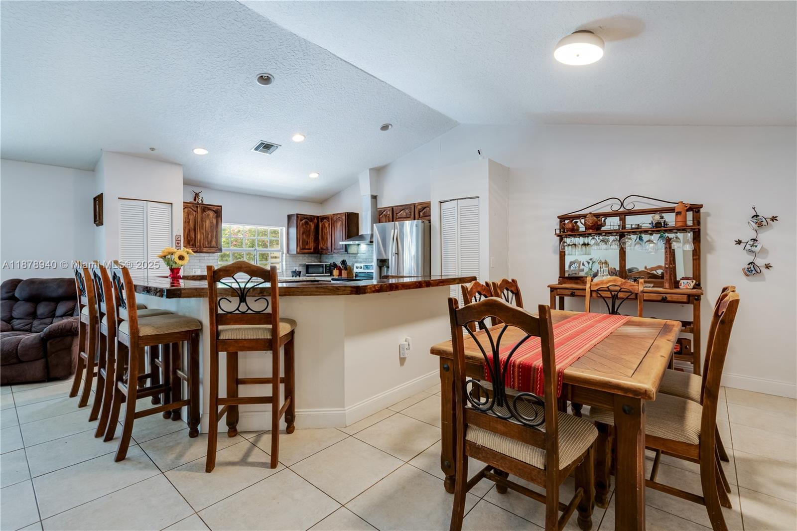 15025 Southwest 141st Court Miami, FL 33186 - Photo 8 of 29 a view of a dining room with furniture