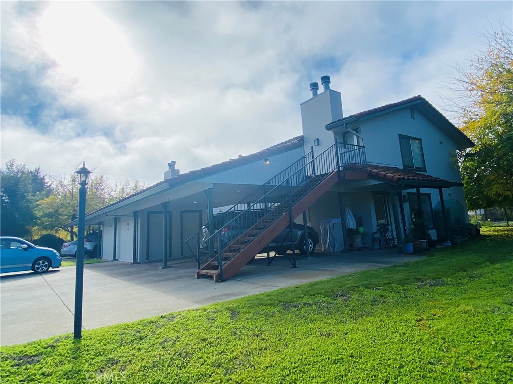19790 Oak Flat Road Hidden Valley Lake, CA 95467 - Photo 1 of 23 a view of a house with a yard