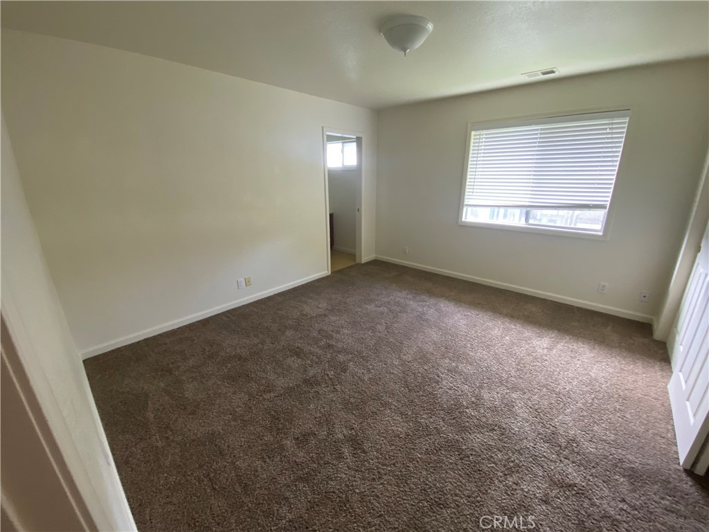 19790 Oak Flat Road Hidden Valley Lake, CA 95467 - Photo 12 of 23 an empty room with windows