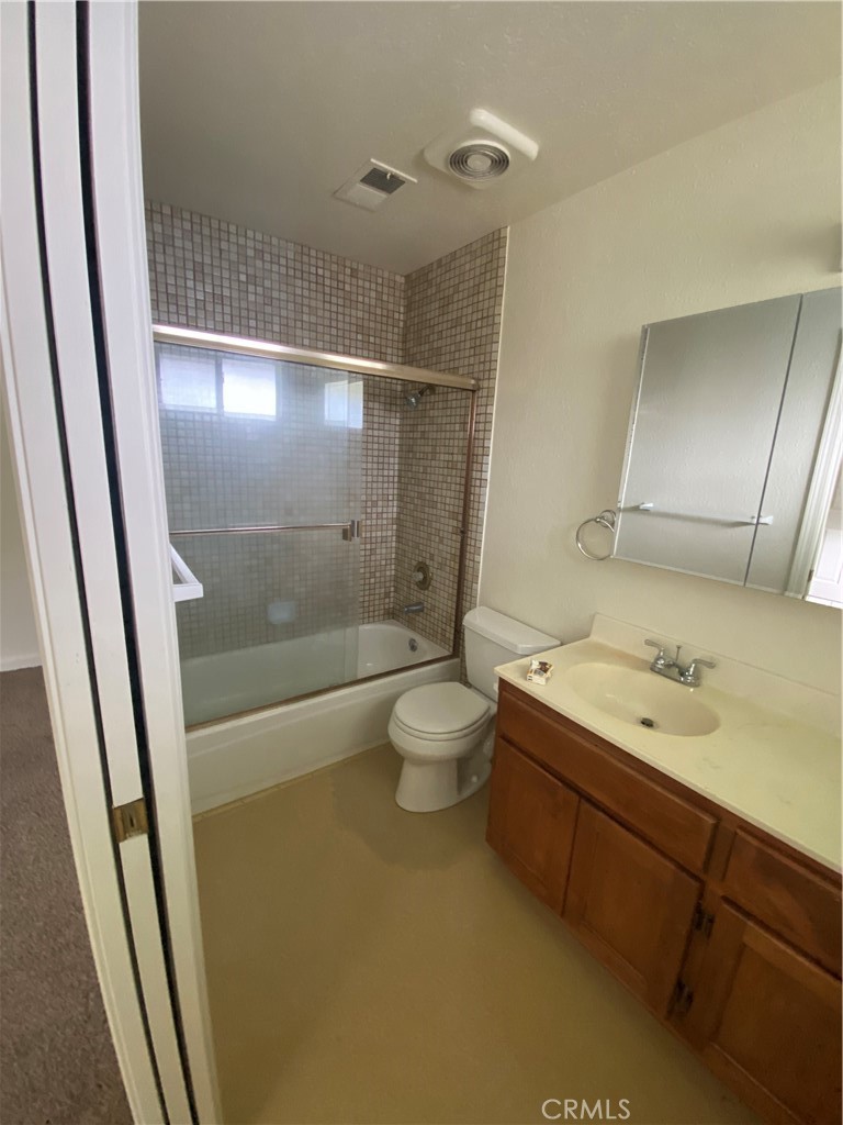 19790 Oak Flat Road Hidden Valley Lake, CA 95467 - Photo 13 of 23 a bathroom with a granite countertop sink shower and a mirror