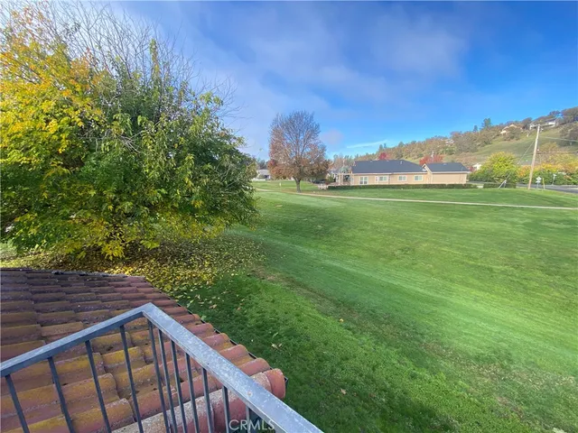 a view of a pathway both side of grassy field