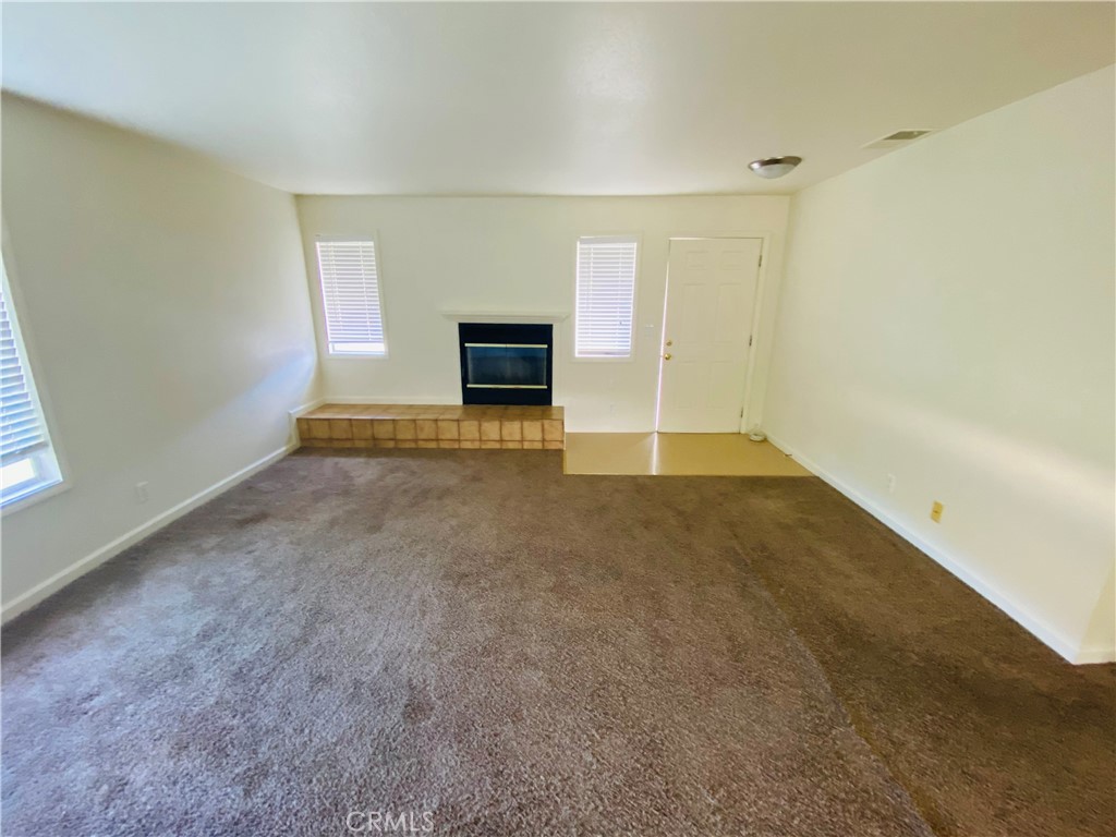 19790 Oak Flat Road Hidden Valley Lake, CA 95467 - Photo 2 of 23 wooden floor in an empty room with a fireplace
