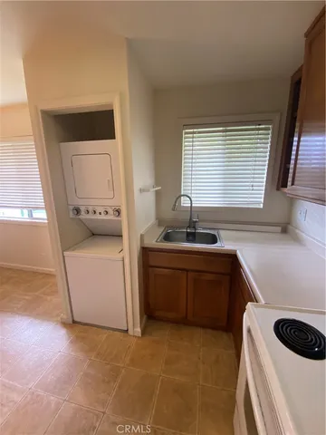 a kitchen with a stove and a sink