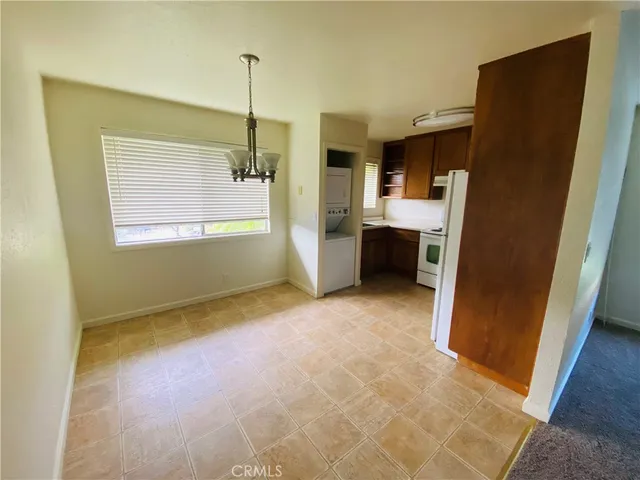 a view of an empty room with a fireplace