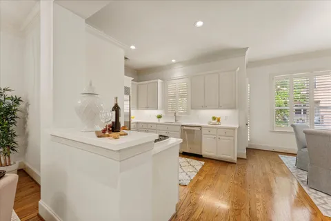 a kitchen with a stove a sink and a microwave