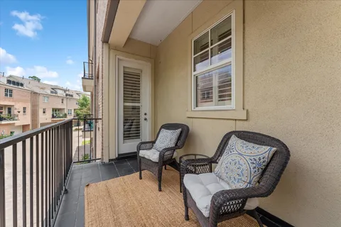 a bed room with a bed and a chair