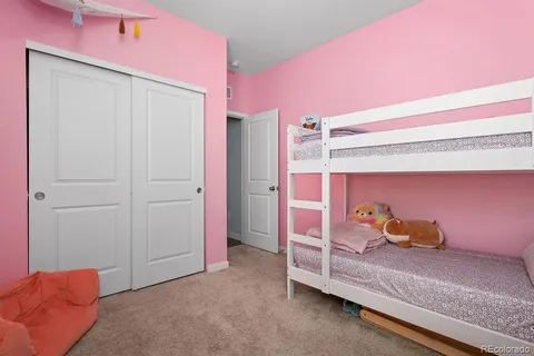 a bed room with a bed and a window