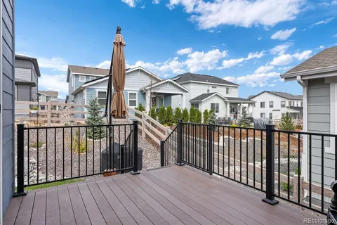 a view of a house with wooden deck