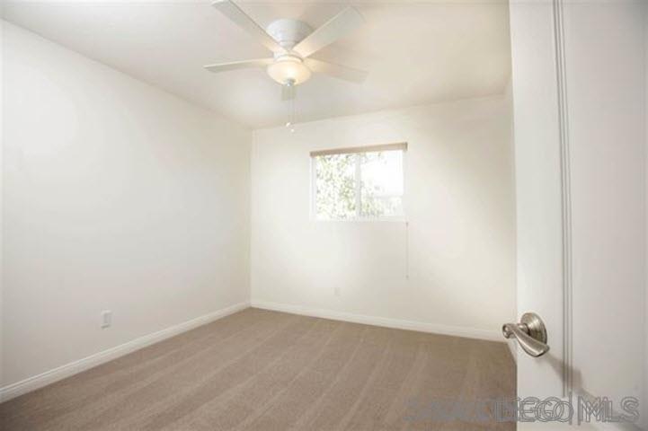 815 Del Mar Downs Road, Unit C Solana Beach, CA 92075 - Photo 12 of 19 an empty room with a window and a fan