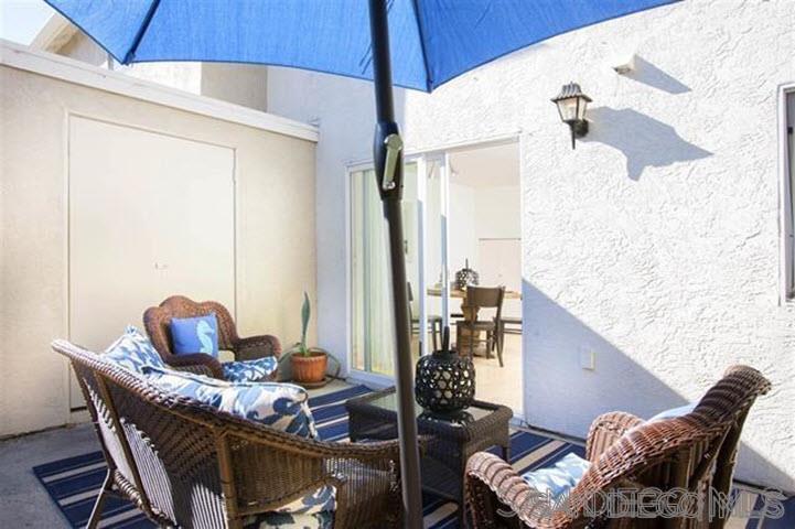 815 Del Mar Downs Road, Unit C Solana Beach, CA 92075 - Photo 16 of 19 a living room with furniture and a window