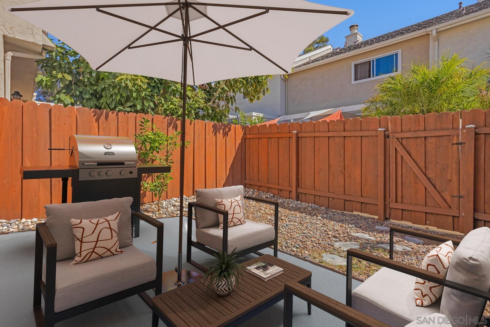 815 Del Mar Downs Road, Unit C Solana Beach, CA 92075 - Photo 2 of 19 a outdoor living space with furniture and umbrella