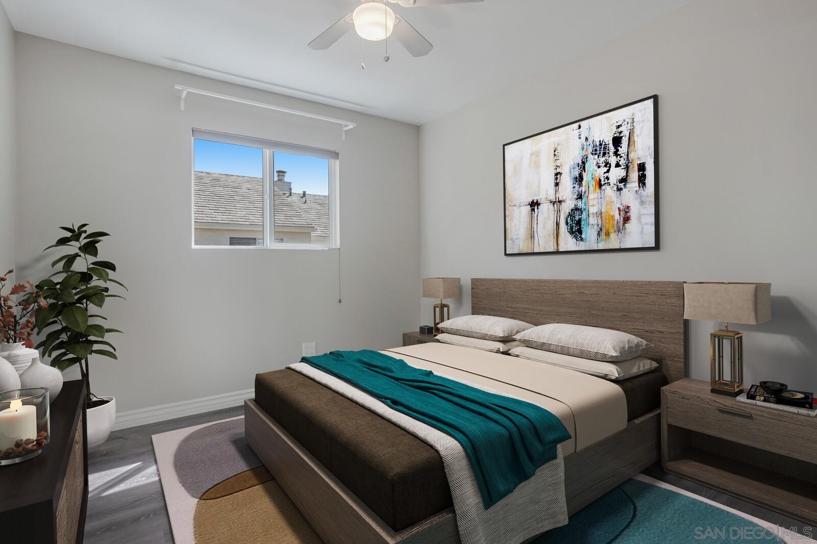 815 Del Mar Downs Road, Unit C Solana Beach, CA 92075 - Photo 4 of 19 a bedroom with bed and a potted plant