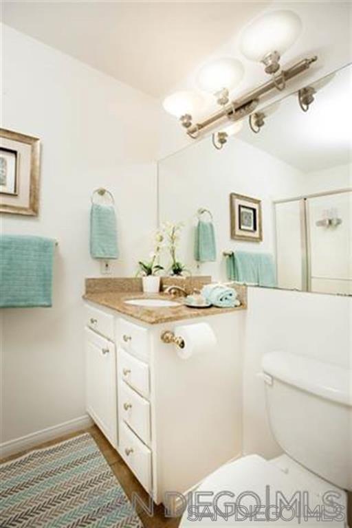 815 Del Mar Downs Road, Unit C Solana Beach, CA 92075 - Photo 10 of 19 a bathroom with a sink a mirror and a toilet