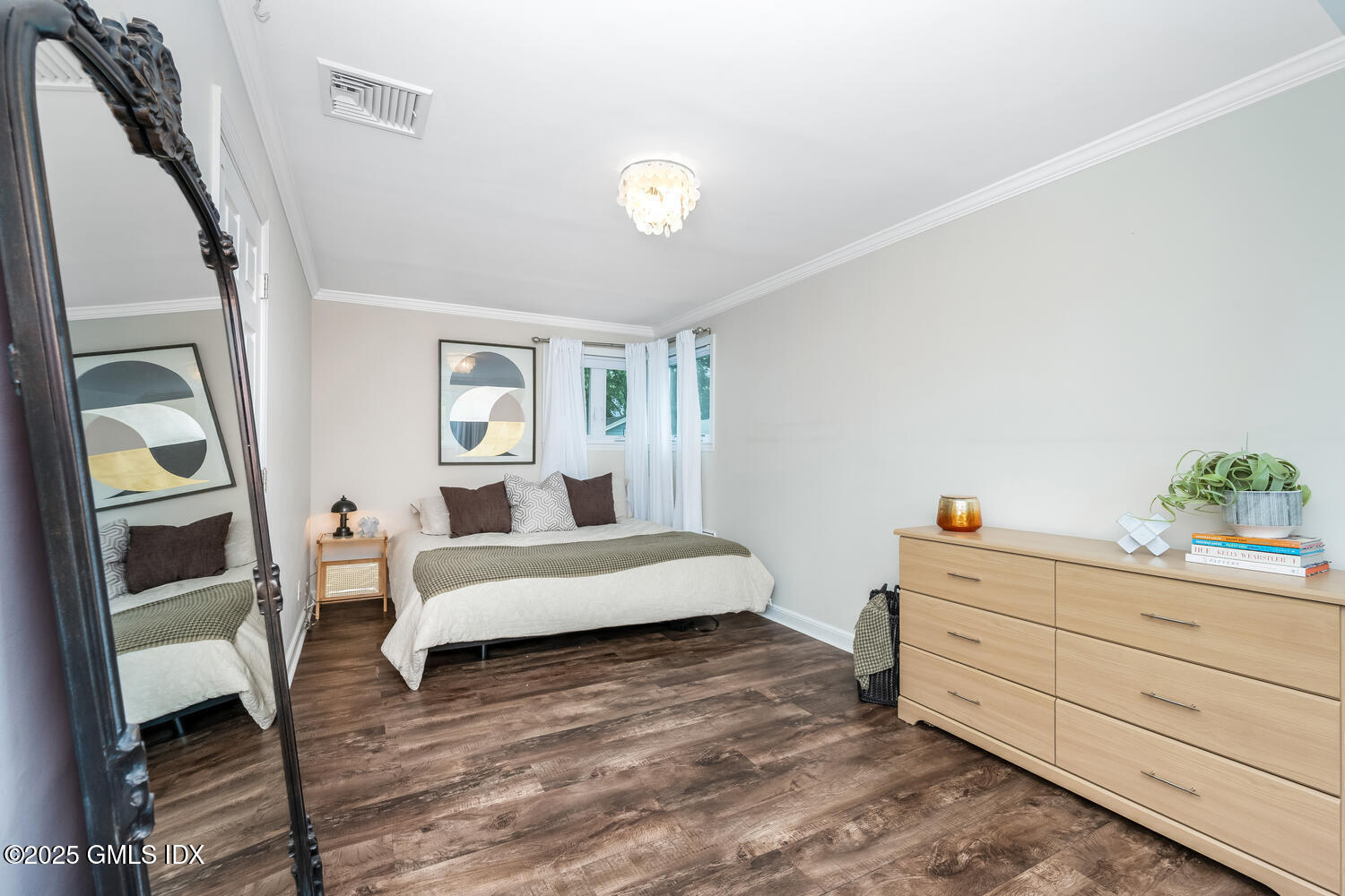 19 High Street Greenwich, CT 06830 - Photo 12 of 25 a spacious bedroom with a bed and a dresser