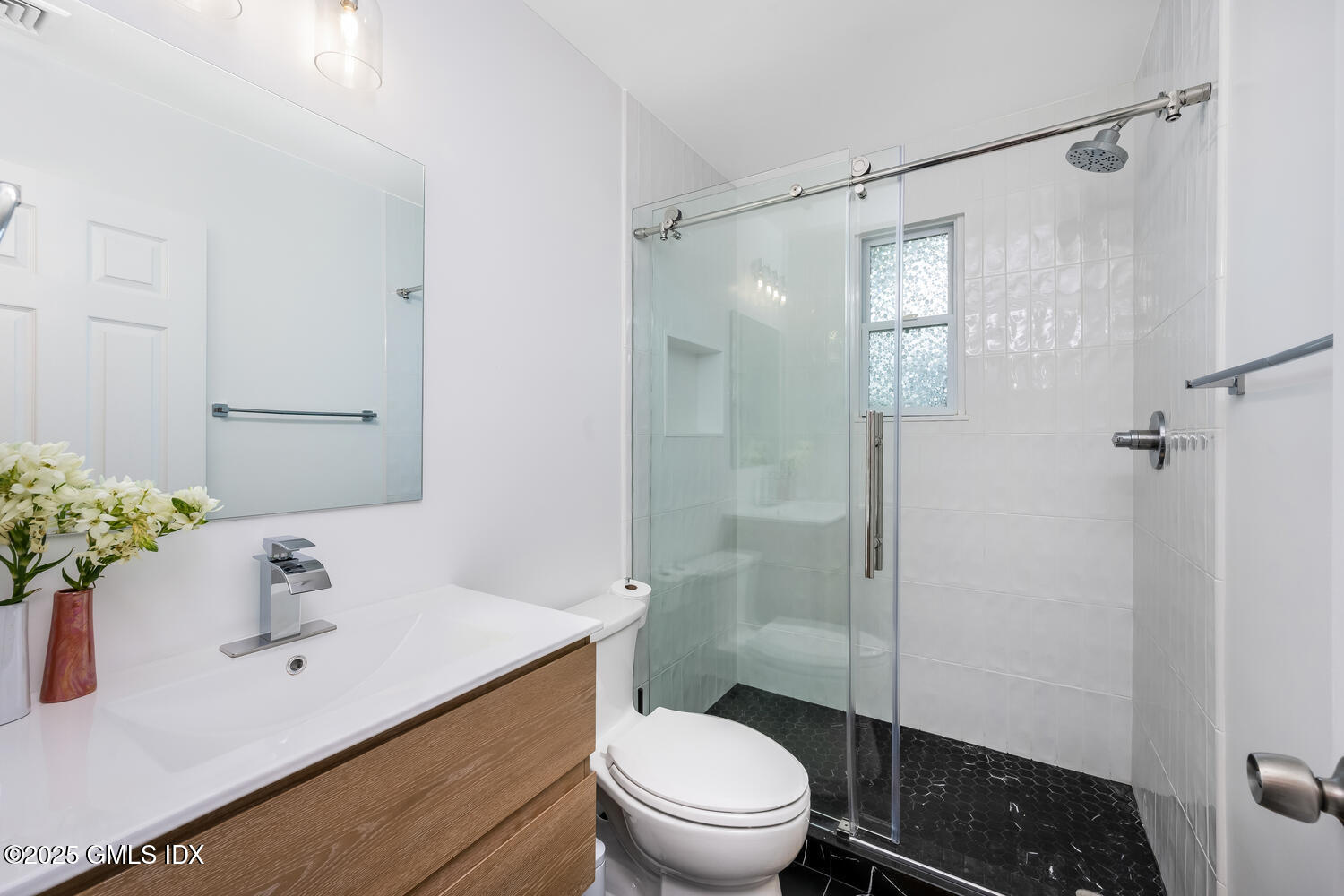 19 High Street Greenwich, CT 06830 - Photo 14 of 25 a bathroom with a sink toilet and shower