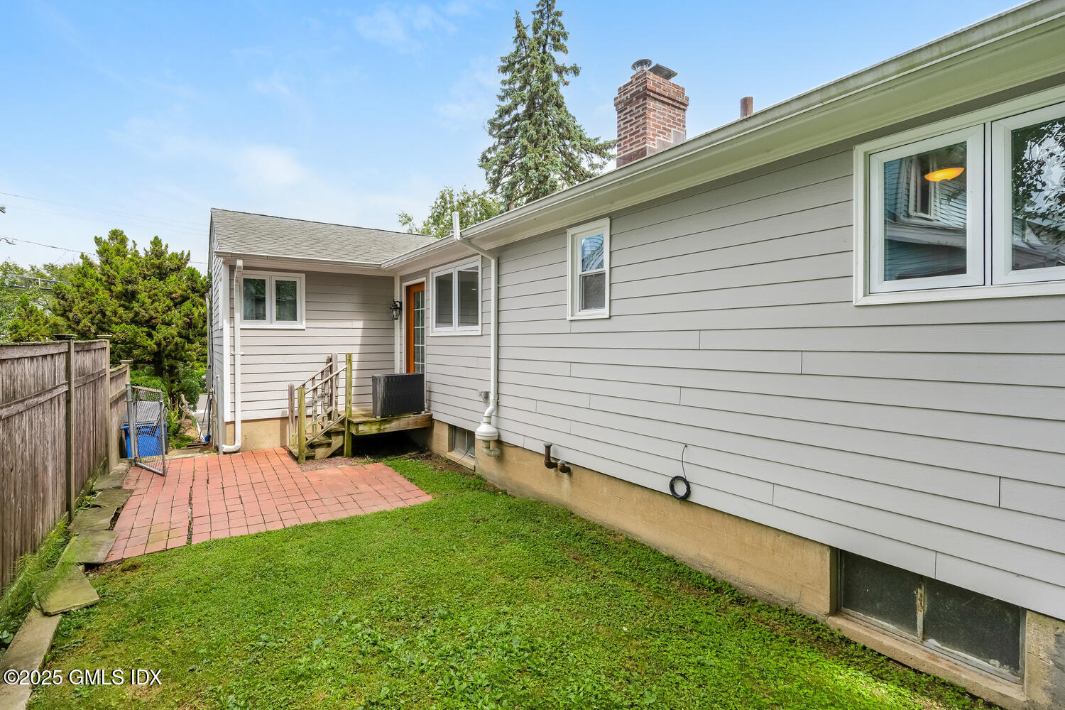 19 High Street Greenwich, CT 06830 - Photo 23 of 25 a view of a house with a backyard