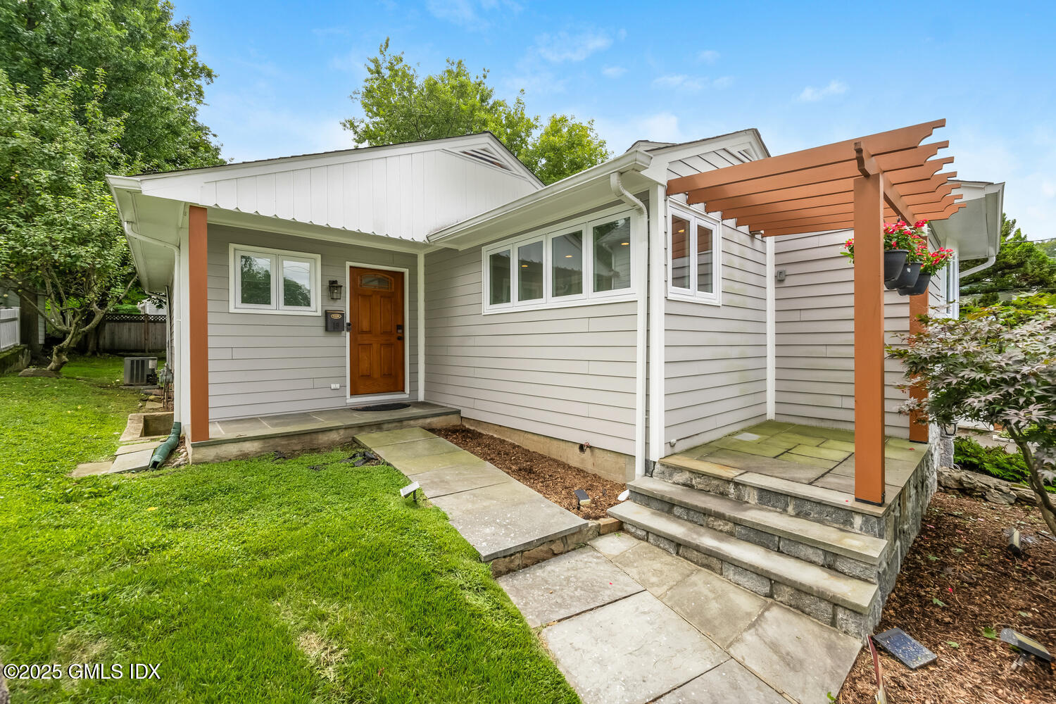 19 High Street Greenwich, CT 06830 - Photo 3 of 25 a view of a house with a yard