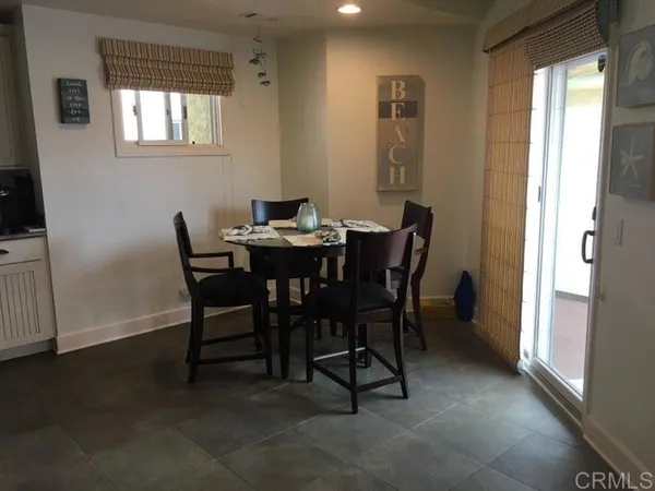 a view of a dining room with furniture and window