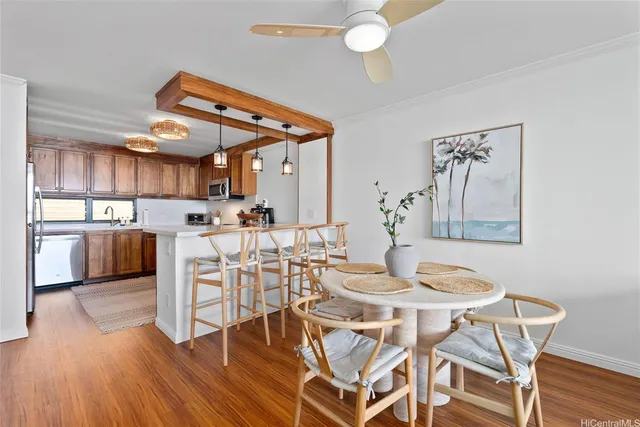 a view of a dining room with furniture and wooden floor