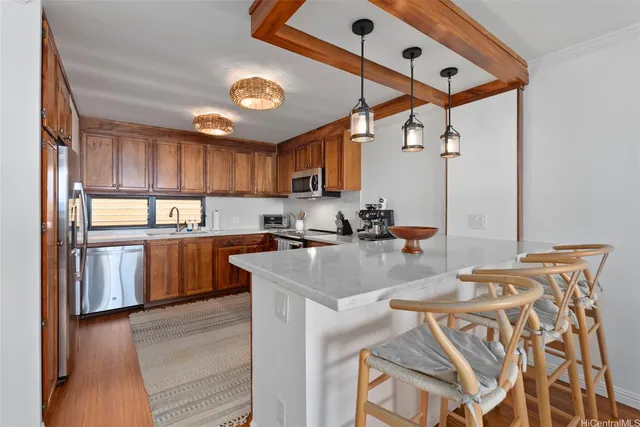 a kitchen with granite countertop a sink appliances and cabinets