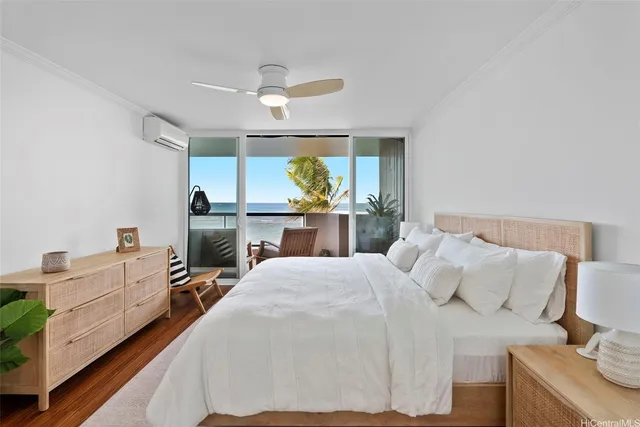 a bed room with a bed and a large window