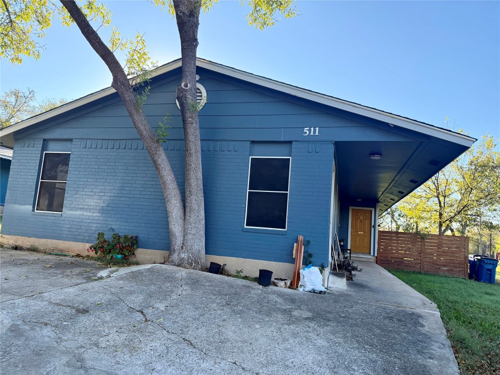 511 Central Avenue, Unit A Elgin, TX 78621 - Photo 2 of 10 a backyard of a house with seating space