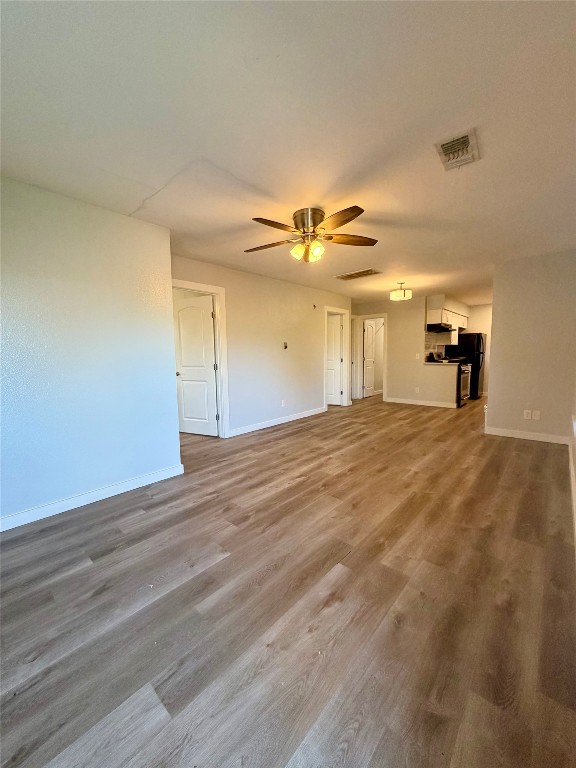 511 Central Avenue, Unit A Elgin, TX 78621 - Photo 6 of 10 a view of an empty room with a window