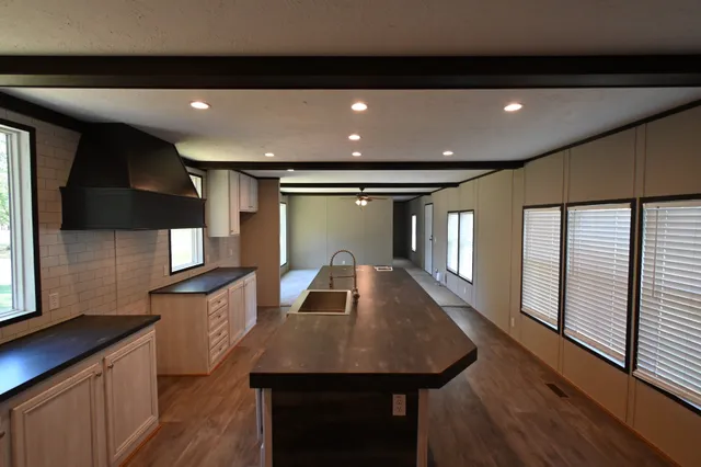 a kitchen with sink and microwave
