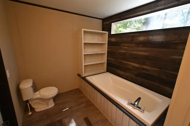 a bathroom with a toilet and a sink