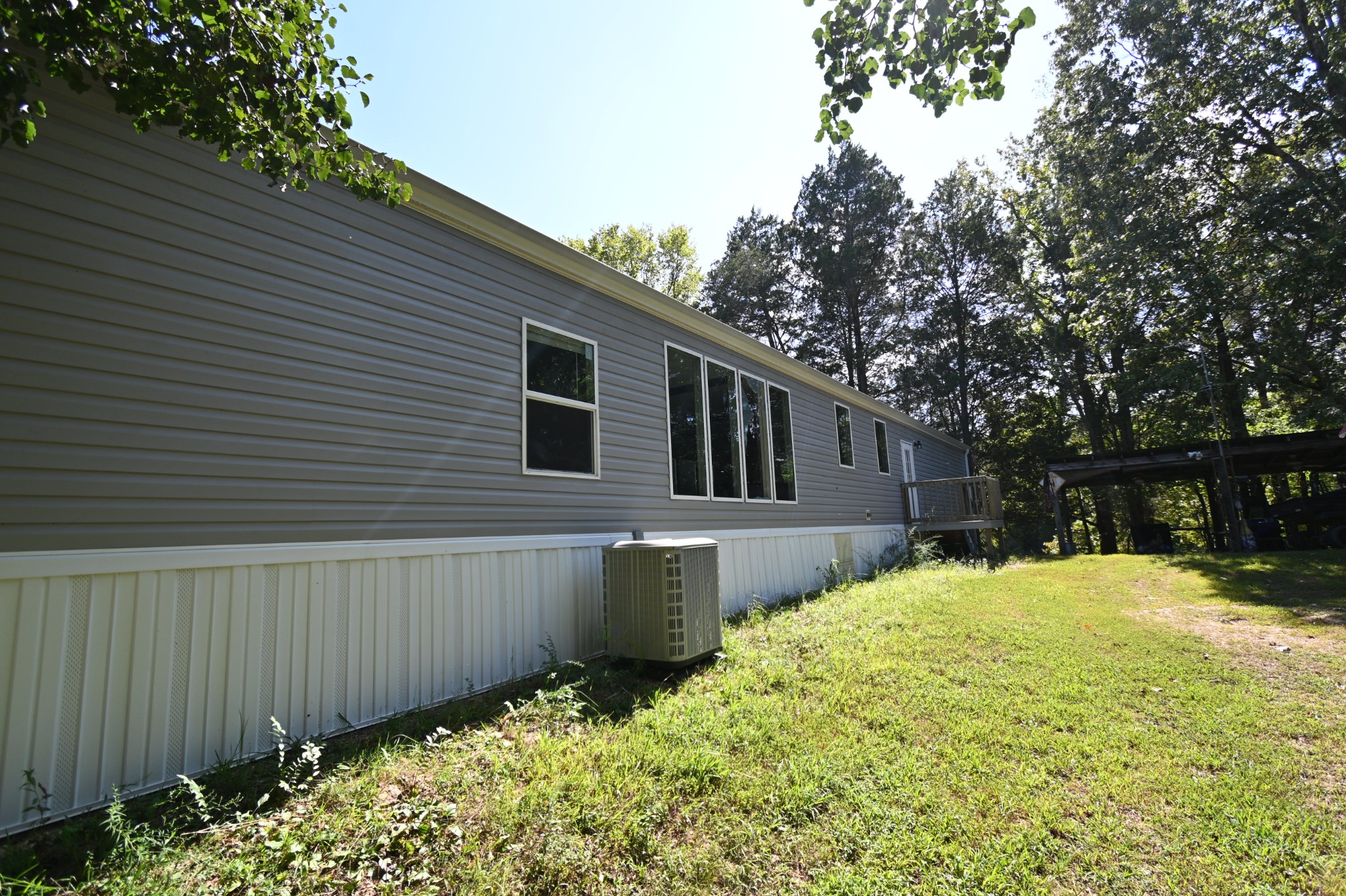 25 Marble Lane Linden, TN 37096 - Photo 31 of 49 a backyard of a house with a large tree