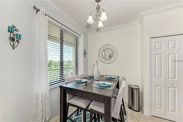 a view of a dining room with furniture and a window