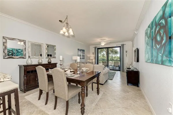 a view of a dining room with furniture window and wooden floor